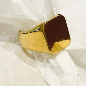 Golden signet ring with shiny finish