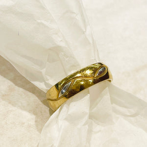 Golden ring with silver details