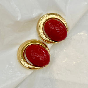 Red cabochon earrings with gold rim