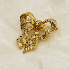 Load the image into the gallery, Gold and silver knot brooch