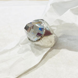 Silver barrel ring with a voluminous cut diamond
