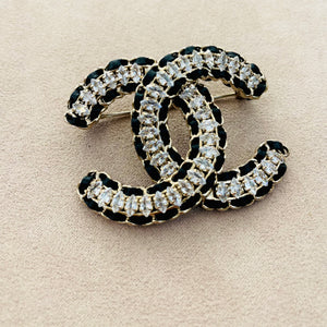 Chanel black laced leather brooch