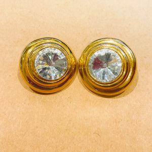 Round white diamond earrings with gold rim