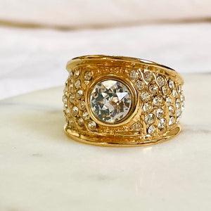 Bangle ring with a central diamond paved all around
