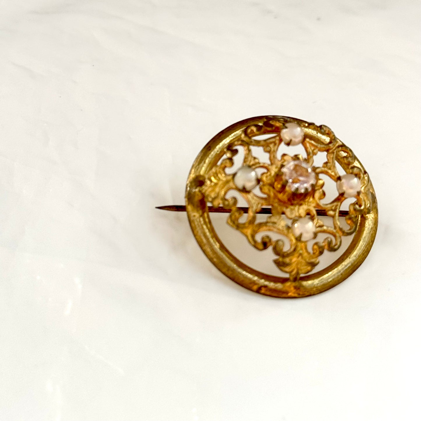 Old round brooch arabesques diamonds and pearls