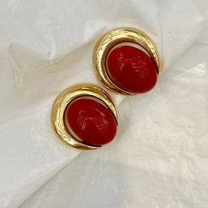 Red cabochon earrings with gold rim