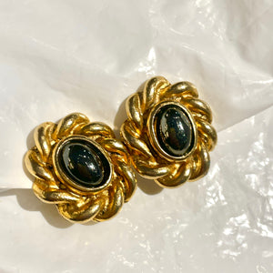 Treasure of oval black pearl curls with golden braid strapping