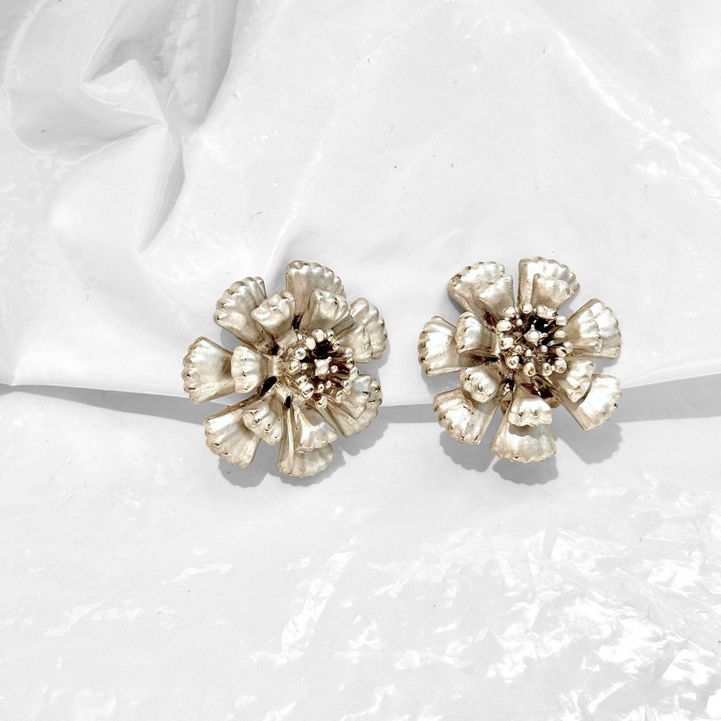 Beautiful silver flower earrings pearl finish