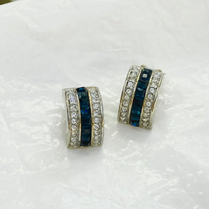 Hoop earrings with lines of round diamonds and princess-cut sapphires