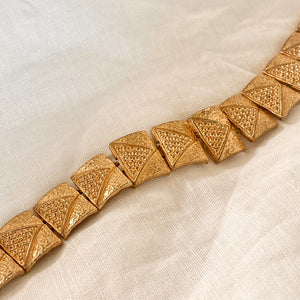Articulated rectangular link bracelet with stamped details