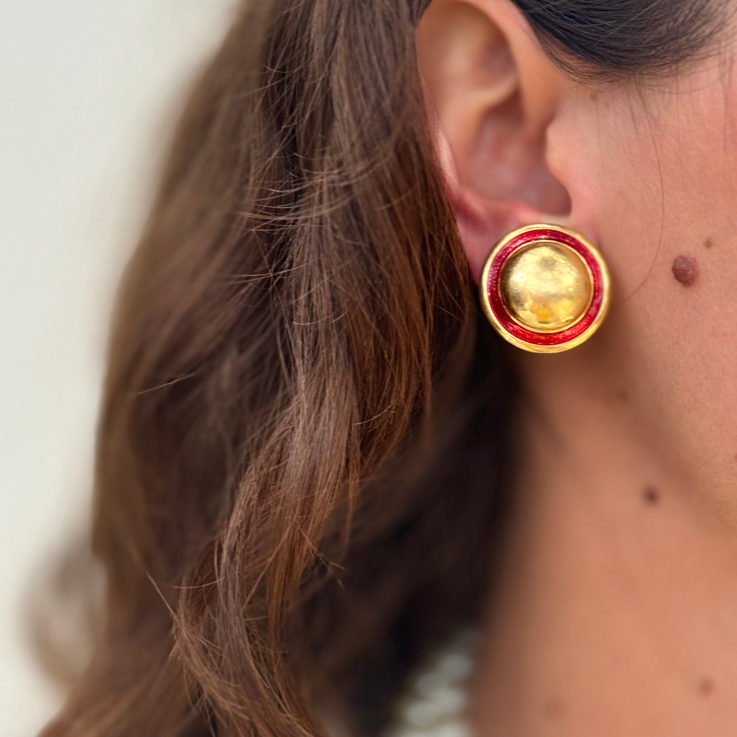 Beautiful round golden earrings red enamel