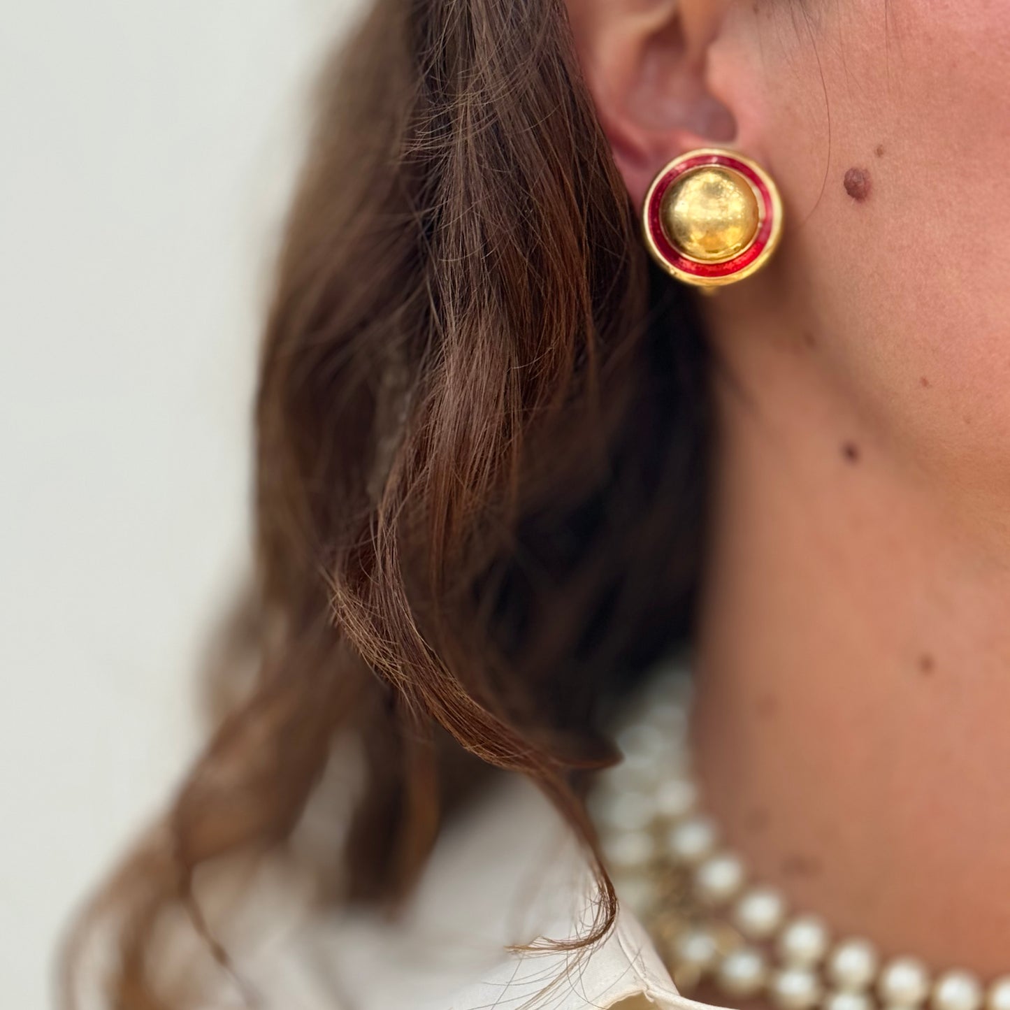 Beautiful round golden earrings red enamel