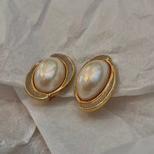 Load the image in the gallery, Pretty white pearl earrings circled in gold and silver