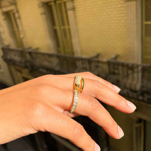 Gold plated ring smooth intertwined lines and vintage white stones from GIGI PARIS