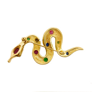 Broche Christian Dior dorée serpent cabochons verts bleus et roses vintage de chez GIGI PARIS