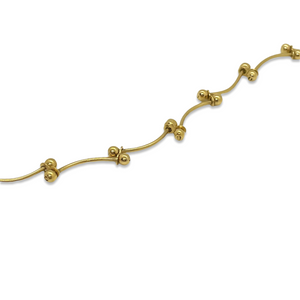 Fine golden bracelet with small golden beads
